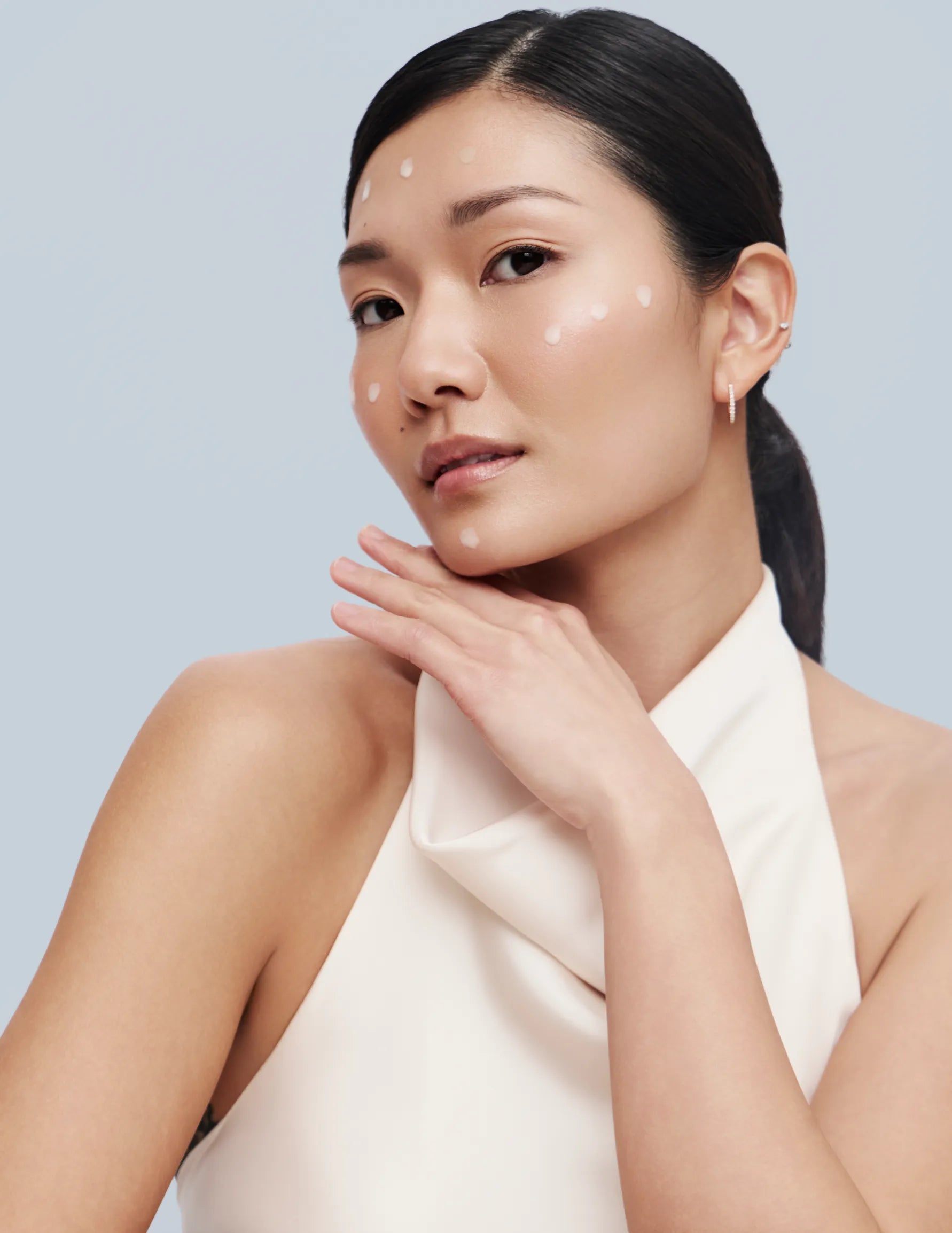 Asian model Applying ZBigatti Treatment on her Face