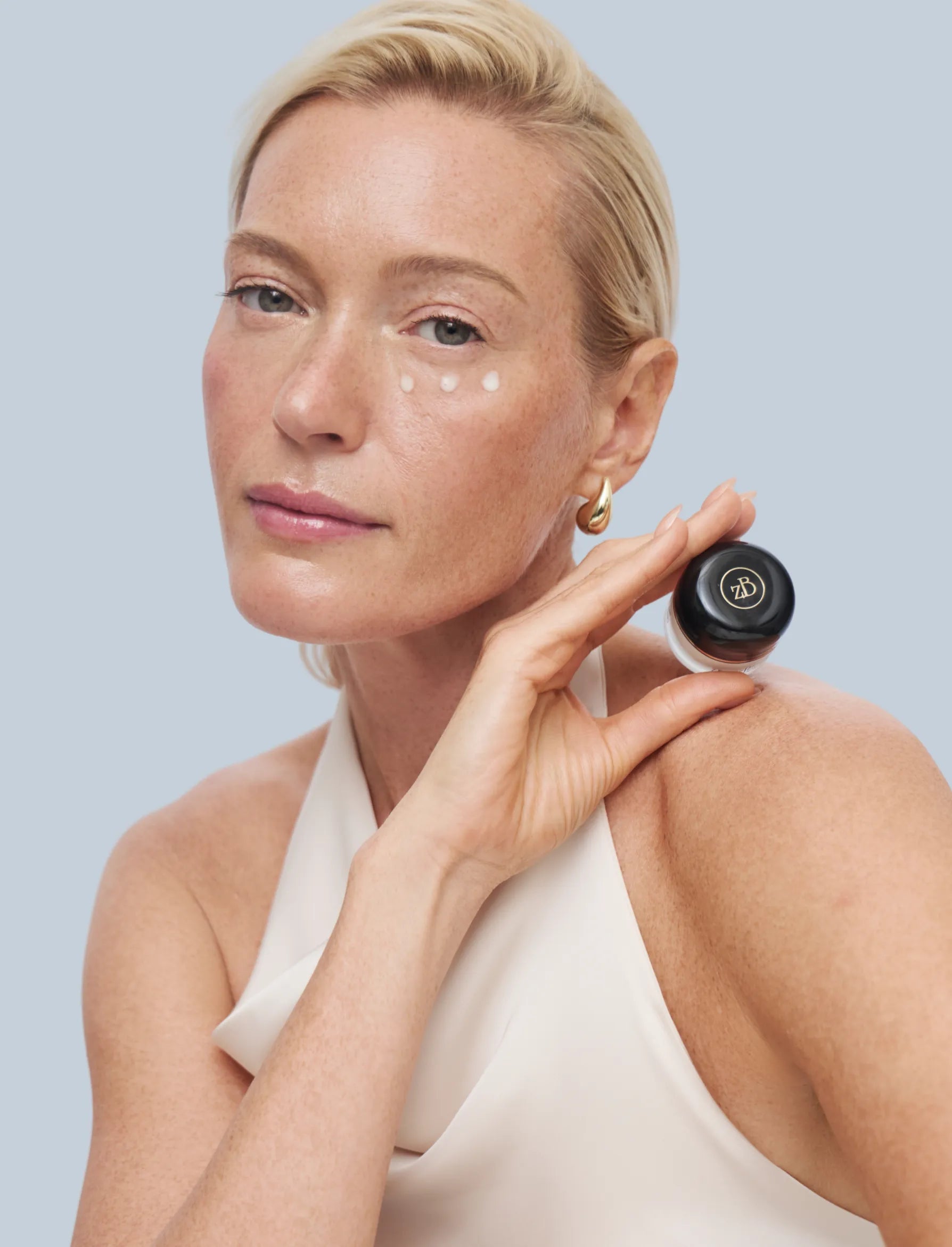 Blond Model Holding Eye Return Product