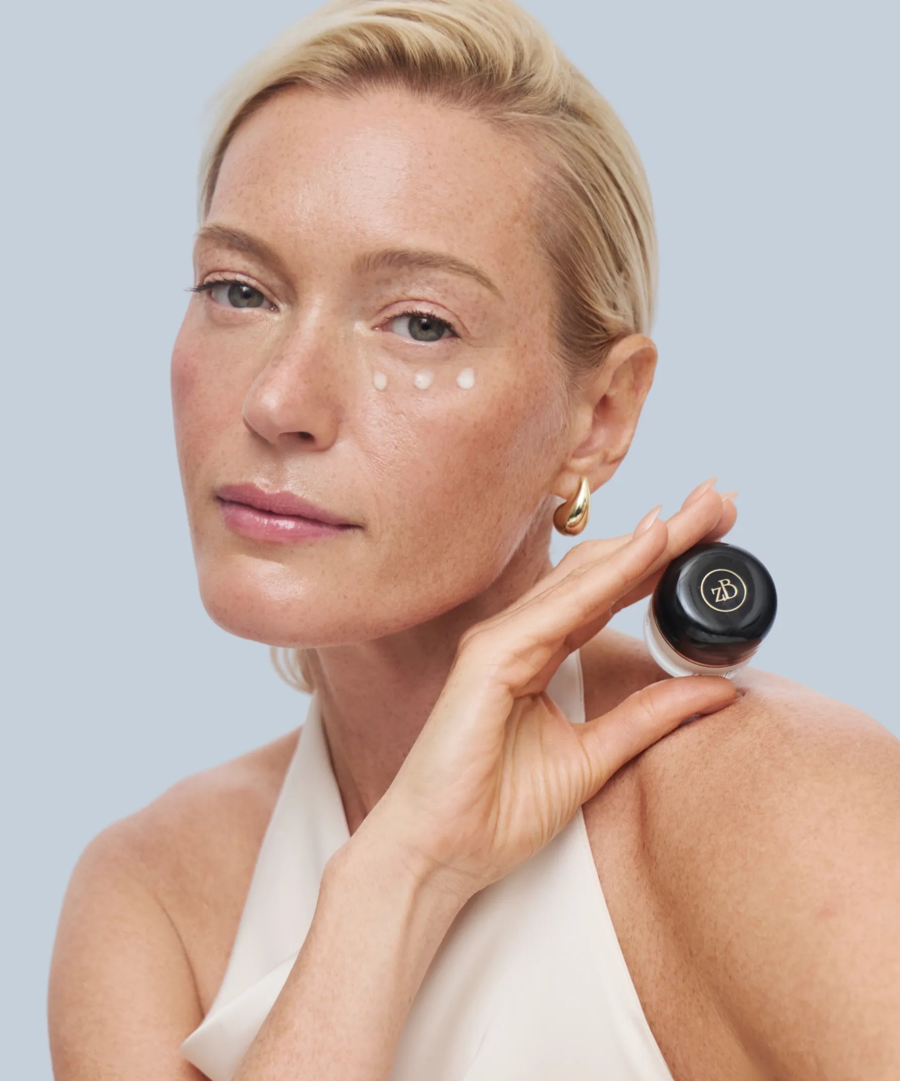Blond model holding Re-Storation Product