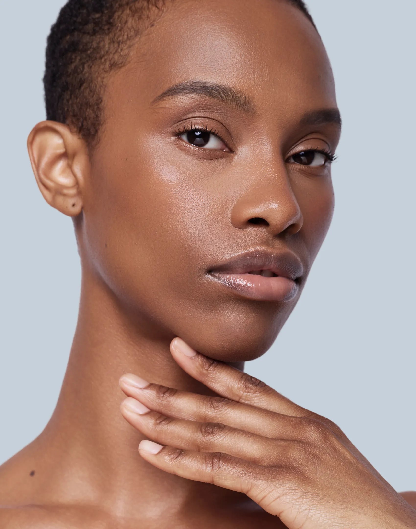 Studio Shot of an African American Woman with Moisturizer applied to skin