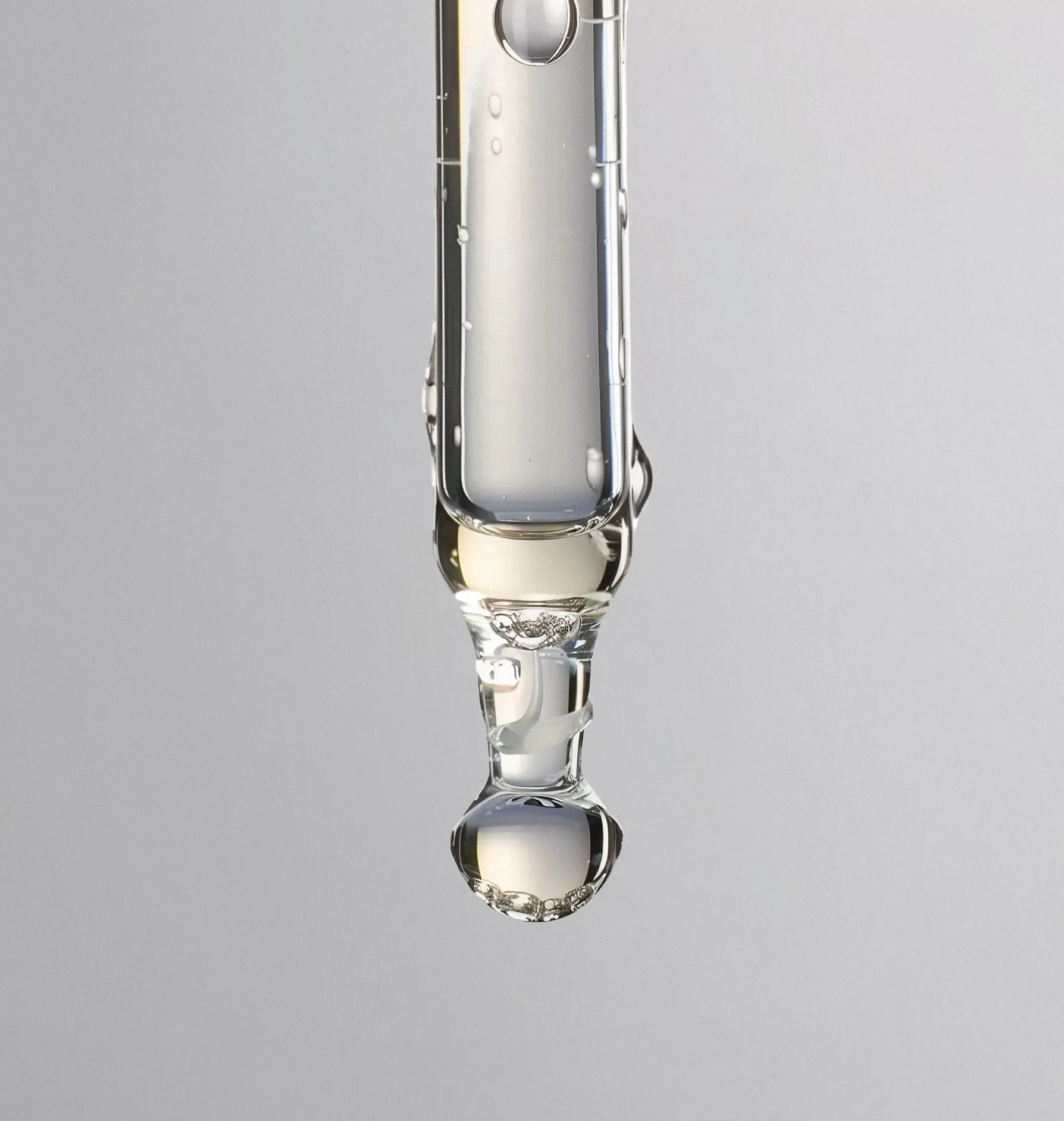 Eyedropper with a drop of skin serum